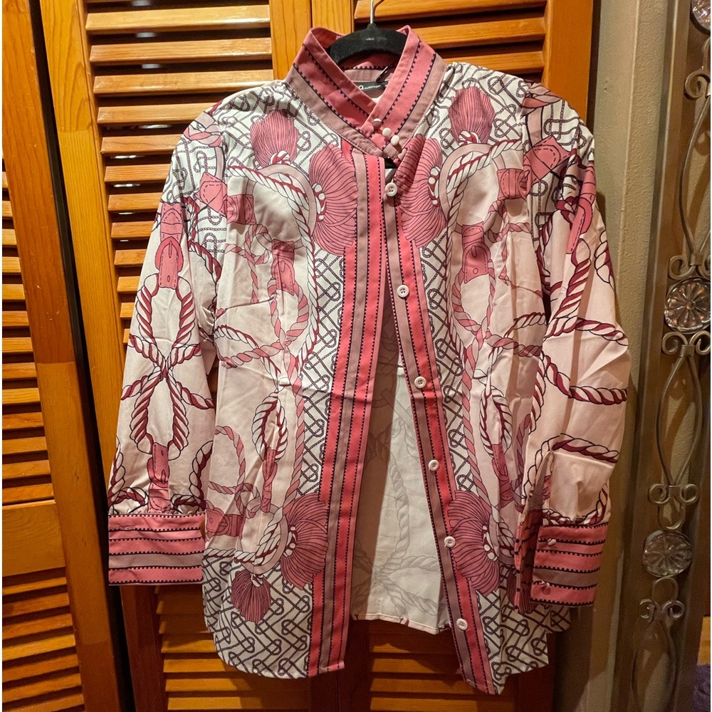 Pastel colors, high neck, covered buttons, long sleeves, dressy like for work.
